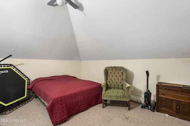 bedroom featuring lofted ceiling, light colored carpet, and ceiling fan