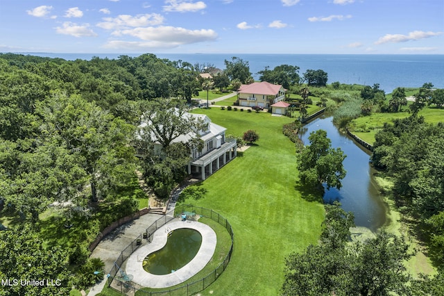 birds eye view of property with a water view