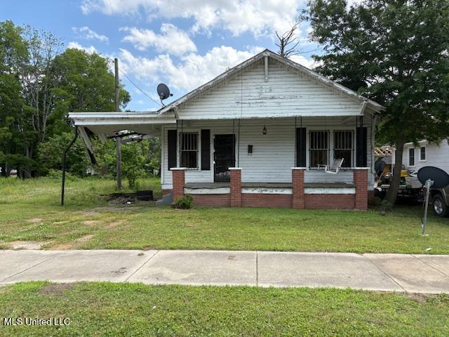 1201-7 Strong Ave, Greenwood, MS 38930 - bungalow-style home with covered porch and a front yard
