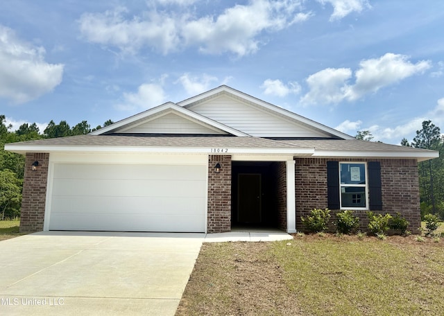 18042 Tiffany Renee Dr, Gulfport, MS 39503 - ranch-style house with brick siding, a garage, concrete driveway, roof with shingles, and a front lawn