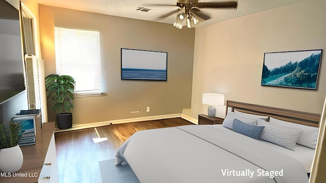 2515 Bryce Cv, Horn Lake, MS 38637 - bedroom with wood finished floors, baseboards, and ceiling fan