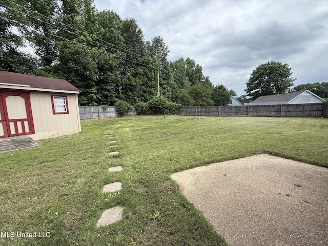 2515 Bryce Cv, Horn Lake, MS 38637 - view of yard featuring a patio, a shed, and an outbuilding