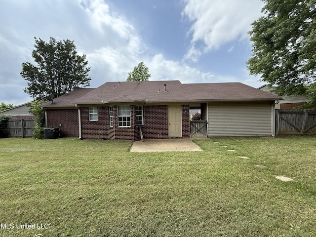 2515 Bryce Cv, Horn Lake, MS 38637 - rear view of property featuring a patio, brick siding, central AC unit, and a gate