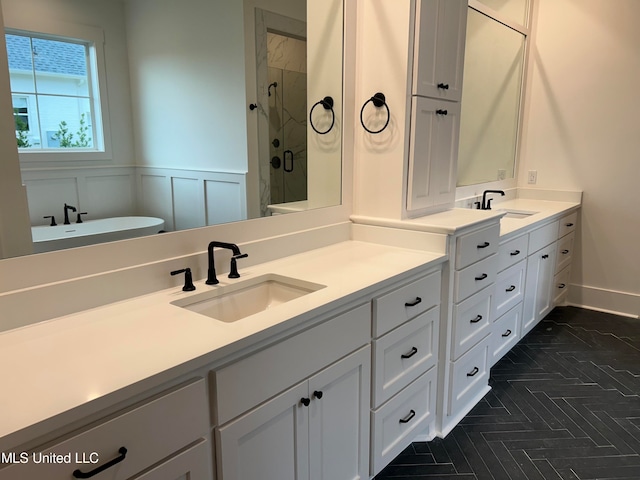 bathroom featuring vanity and a shower with shower door