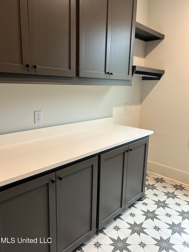 kitchen featuring dark brown cabinets