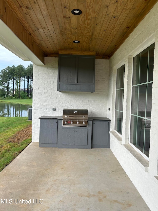 view of patio featuring a water view, central AC, and a grill