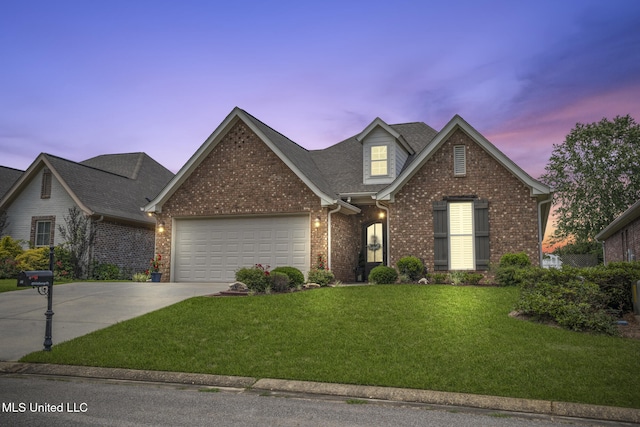 23 Callaway Ct, Hattiesburg, MS 39402 - traditional-style home featuring a garage, concrete driveway, brick siding, and a yard