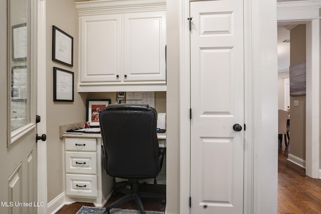 23 Callaway Ct, Hattiesburg, MS 39402 - office space with built in study area, dark wood-style floors, and baseboards