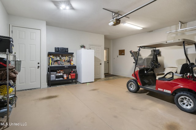 23 Callaway Ct, Hattiesburg, MS 39402 - garage with a garage door opener and freestanding refrigerator