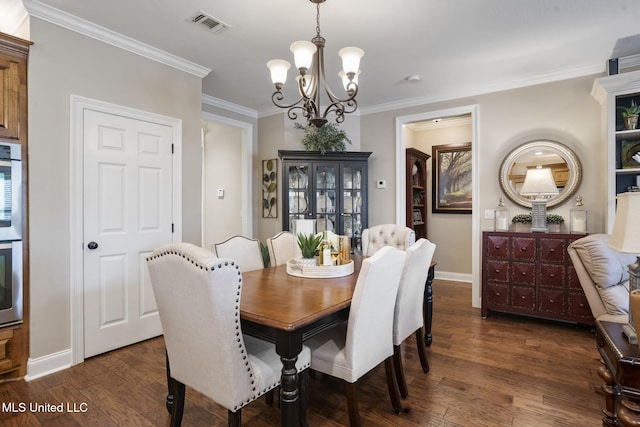 23 Callaway Ct, Hattiesburg, MS 39402 - dining space featuring a chandelier, dark wood finished floors, baseboards, and crown molding