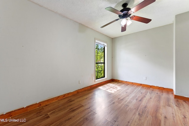20 Yorkshire Pkwy, Gulfport, MS 39503 - empty room featuring baseboards, wood finished floors, a ceiling fan, and a textured ceiling