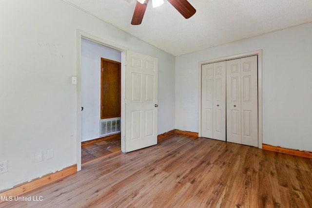 20 Yorkshire Pkwy, Gulfport, MS 39503 - unfurnished bedroom featuring light wood-style flooring, baseboards, a closet, and ceiling fan