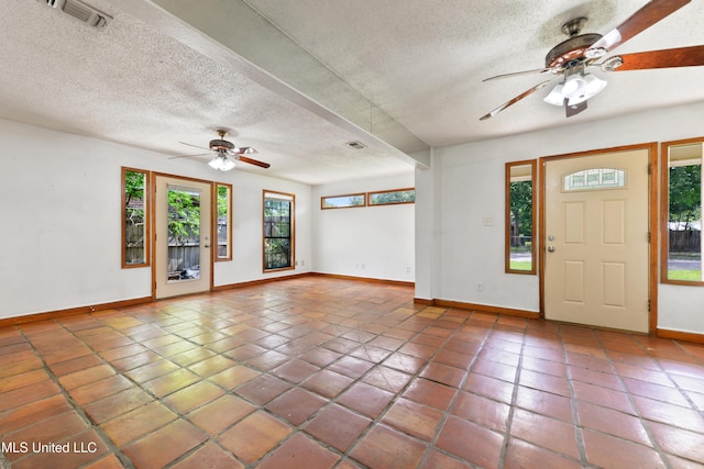 20 Yorkshire Pkwy, Gulfport, MS 39503 - entryway featuring a ceiling fan, baseboards, a textured ceiling, and tile patterned floors