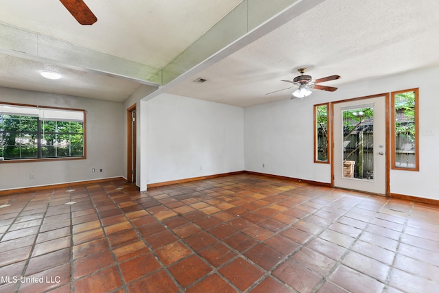 20 Yorkshire Pkwy, Gulfport, MS 39503 - tiled empty room with a ceiling fan, baseboards, and a textured ceiling