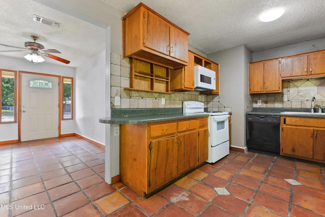20 Yorkshire Pkwy, Gulfport, MS 39503 - kitchen with white appliances, a sink, a textured ceiling, decorative backsplash, and dark countertops