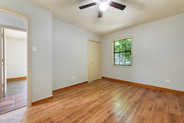 20 Yorkshire Pkwy, Gulfport, MS 39503 - spare room featuring a ceiling fan, light wood-style floors, baseboards, and a textured ceiling