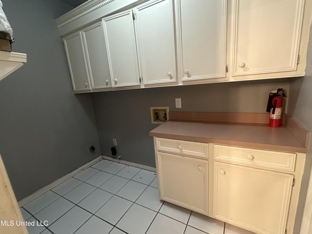 713 Hawthorn Green Dr, Ridgeland, MS 39157 - washroom with cabinet space, washer hookup, light tile patterned floors, and baseboards