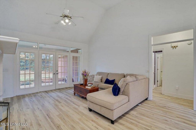 living room featuring french doors, light wood-type flooring, ceiling fan, and high vaulted ceiling