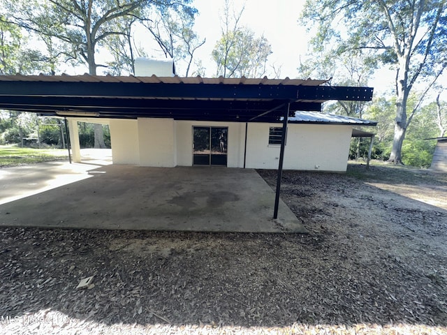 exterior space with a carport