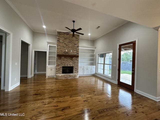 unfurnished living room featuring visible vents, a ceiling fan, baseboards, and crown molding