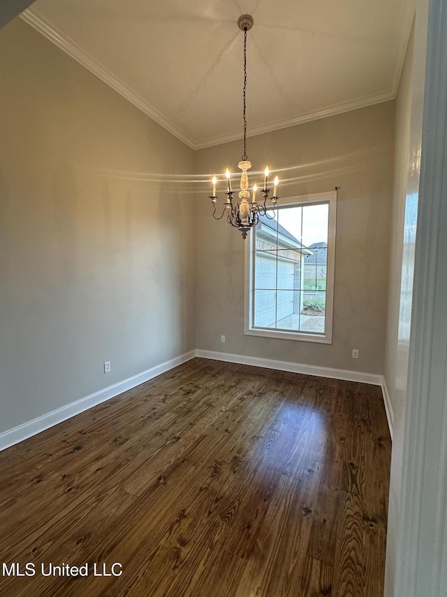 spare room with dark wood-style flooring, baseboards, a notable chandelier, and ornamental molding