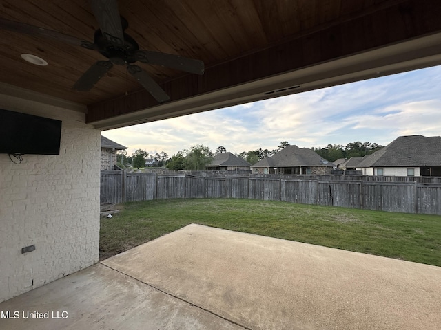 view of patio / terrace with a ceiling fan, a fenced backyard, and a residential view