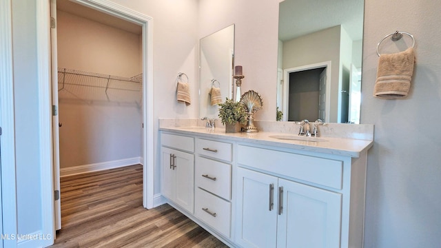 bathroom featuring vanity and hardwood / wood-style flooring