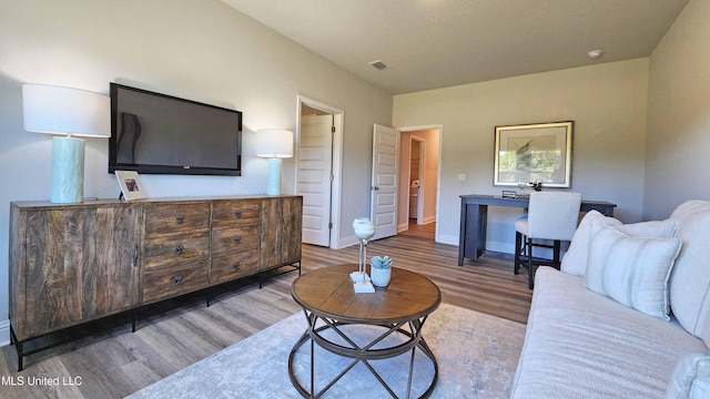 living room with light hardwood / wood-style floors