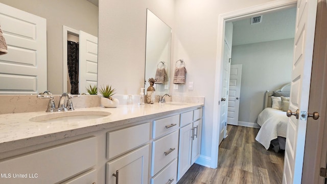 bathroom featuring vanity and wood-type flooring