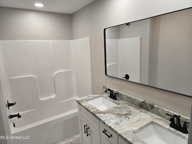 bathroom with shower / bathing tub combination and vanity