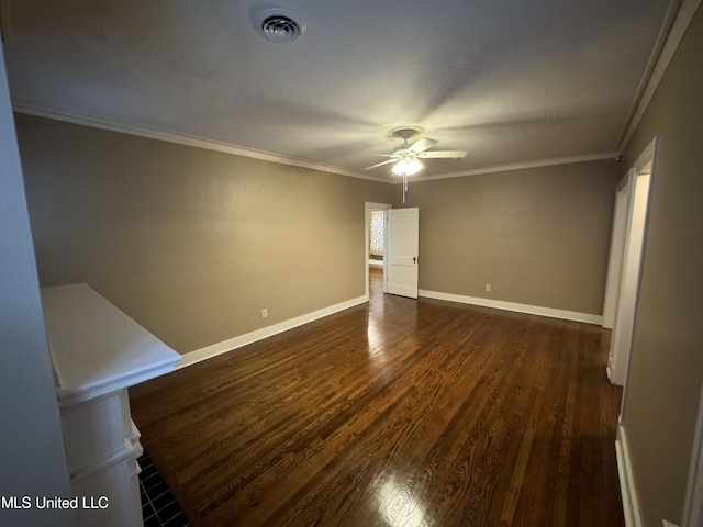 unfurnished room with ornamental molding, dark wood-type flooring, and ceiling fan