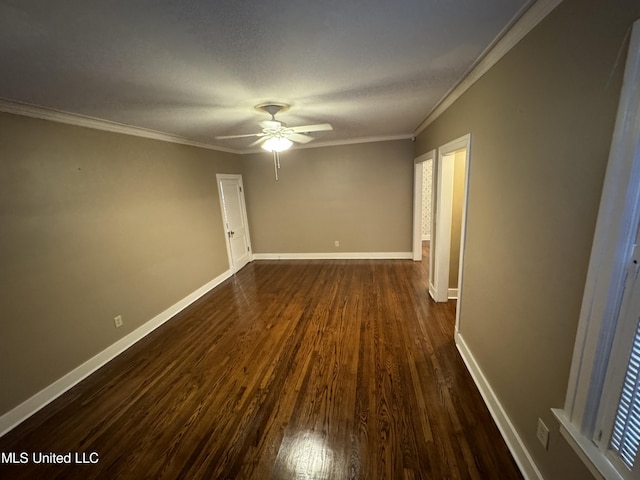 unfurnished room with crown molding, ceiling fan, and dark hardwood / wood-style flooring