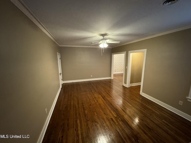 empty room featuring dark wood-type flooring, crown molding, and ceiling fan