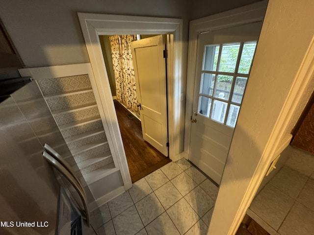 doorway featuring light tile patterned floors