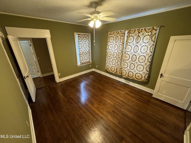 unfurnished bedroom featuring crown molding, a textured ceiling, wood-type flooring, and ceiling fan