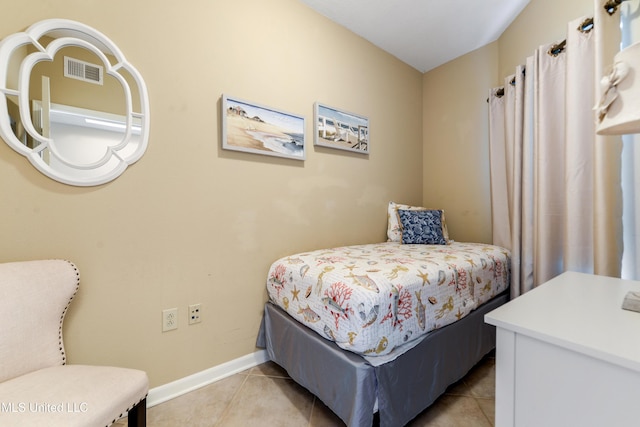 bedroom featuring light tile patterned floors