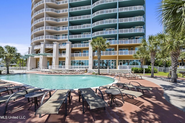 view of swimming pool with a patio