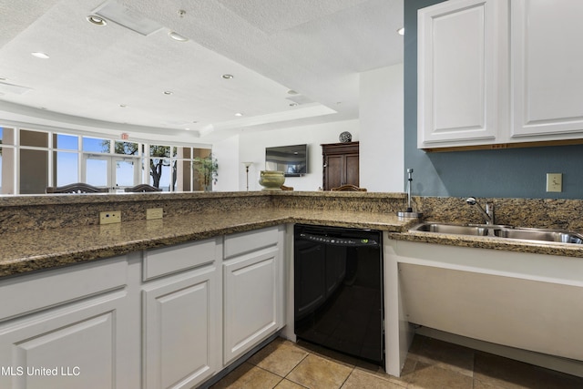 kitchen with dishwasher, white cabinets, a textured ceiling, and sink