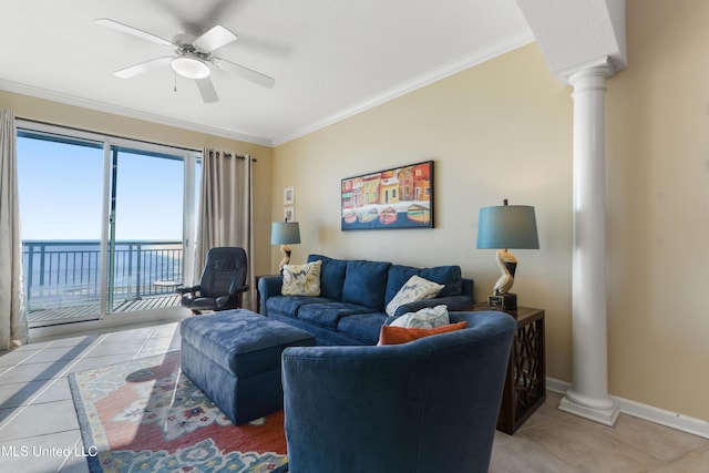 tiled living room featuring decorative columns, ceiling fan, ornamental molding, and a water view