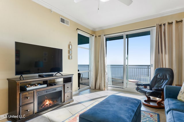 2228 Beach Dr Unit 907, Gulfport, MS 39507 - living area with ornamental molding, a ceiling fan, and light tile patterned flooring
