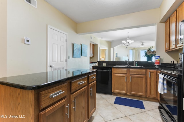 kitchen featuring a center island, black appliances, ceiling fan with notable chandelier, sink, and light tile patterned flooring