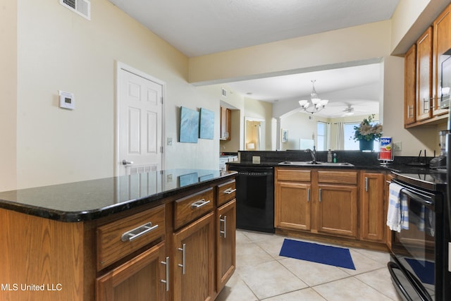 2228 Beach Dr Unit 907, Gulfport, MS 39507 - kitchen featuring black appliances, a chandelier, brown cabinets, and light tile patterned floors