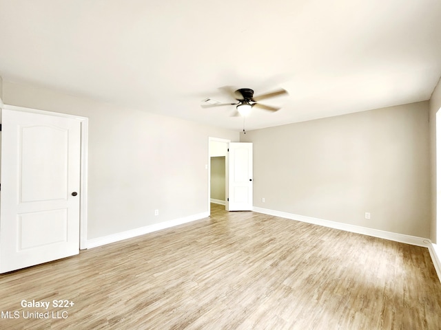 unfurnished room with ceiling fan and light hardwood / wood-style floors