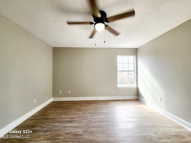 spare room featuring hardwood / wood-style floors, a textured ceiling, and ceiling fan