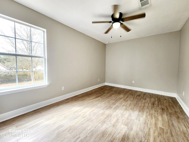 empty room featuring ceiling fan and light hardwood / wood-style floors