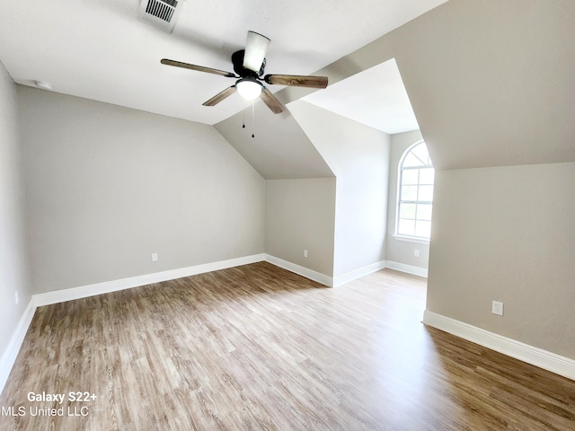 bonus room featuring lofted ceiling, light hardwood / wood-style floors, and ceiling fan