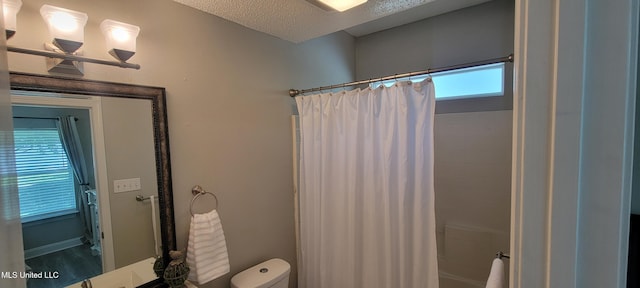 8422 Kaleki Way, Diamondhead, MS 39525 - full bathroom featuring shower / bathtub combination with curtain, toilet, and a textured ceiling