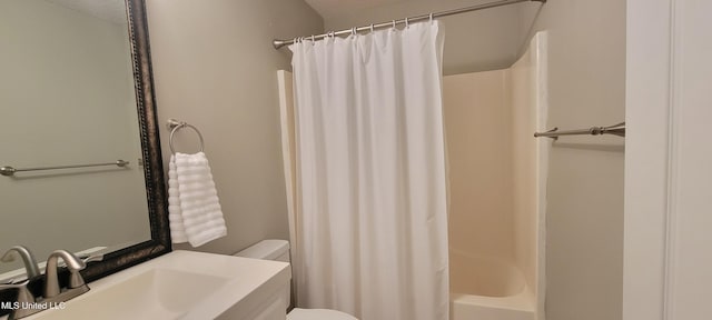 8422 Kaleki Way, Diamondhead, MS 39525 - full bathroom with toilet, vanity, and shower / tub combo with curtain