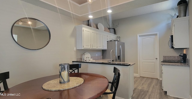 8422 Kaleki Way, Diamondhead, MS 39525 - dining area featuring light wood-style floors and baseboards