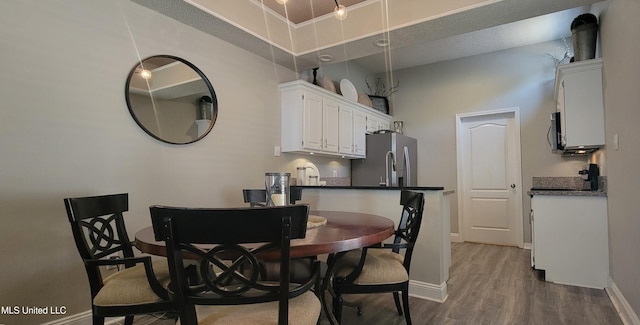 8422 Kaleki Way, Diamondhead, MS 39525 - dining space with wood finished floors and baseboards